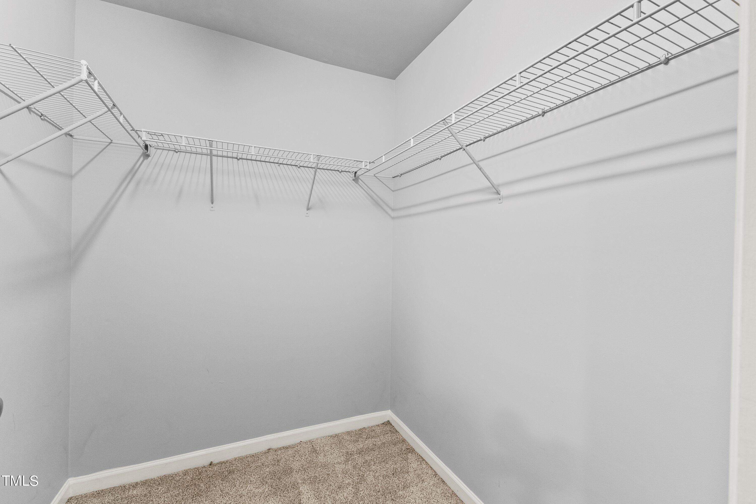 350 Gilman Lane, Unit 108 Raleigh, NC 27610 - Photo 27 of 34 a view of a room with racks on the wall