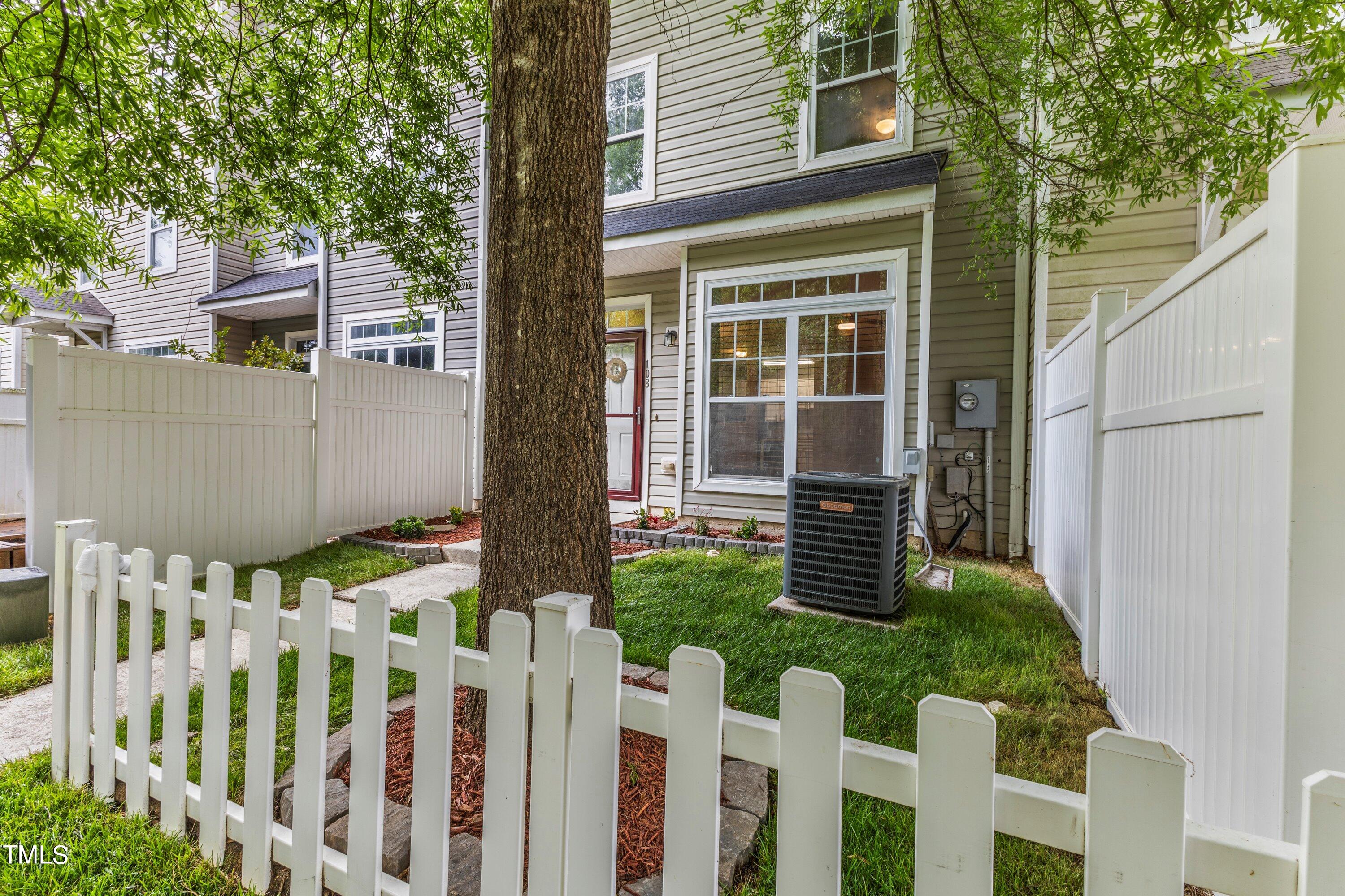 350 Gilman Lane, Unit 108 Raleigh, NC 27610 - Photo 30 of 34 a front view of a house with a yard