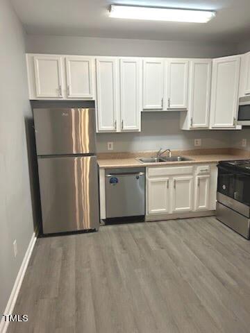 350 Gilman Lane, Unit 108 Raleigh, NC 27610 - Photo 7 of 34 a kitchen with granite countertop a refrigerator sink and cabinets