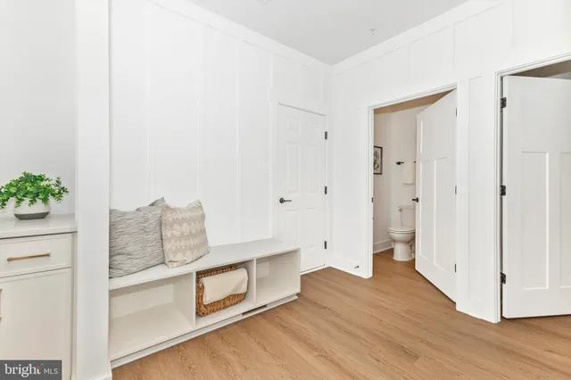 a view of entryway and hall with wooden floor