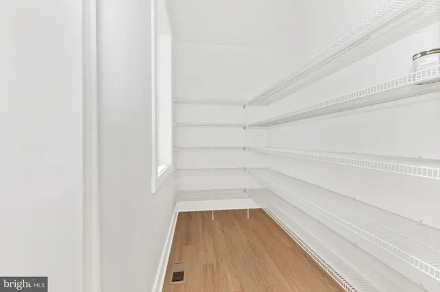 a spacious bedroom with a bed and a couch