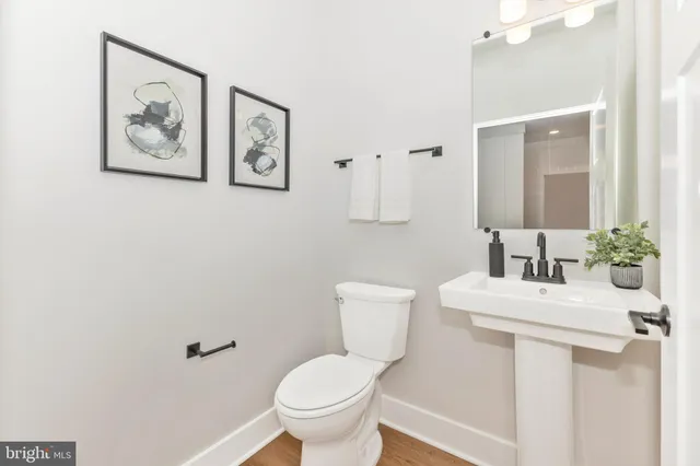 a bathroom with a sink and mirror
