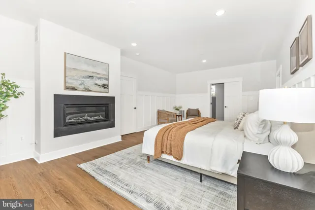 a view of walk in closet with wooden floor