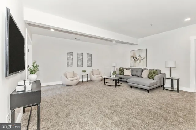 a living room with a couch and a table