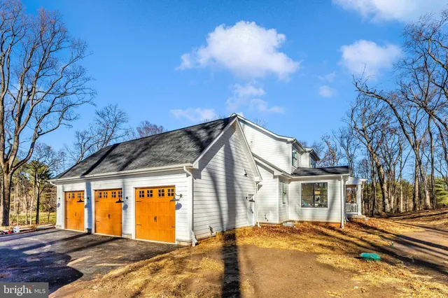 a view of building with wooden fence