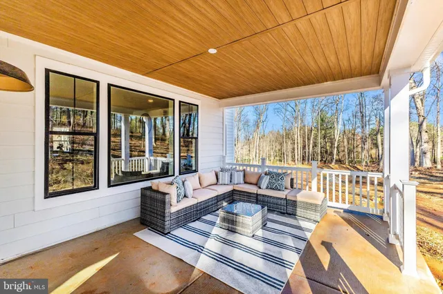 an aerial view of houses with backyard