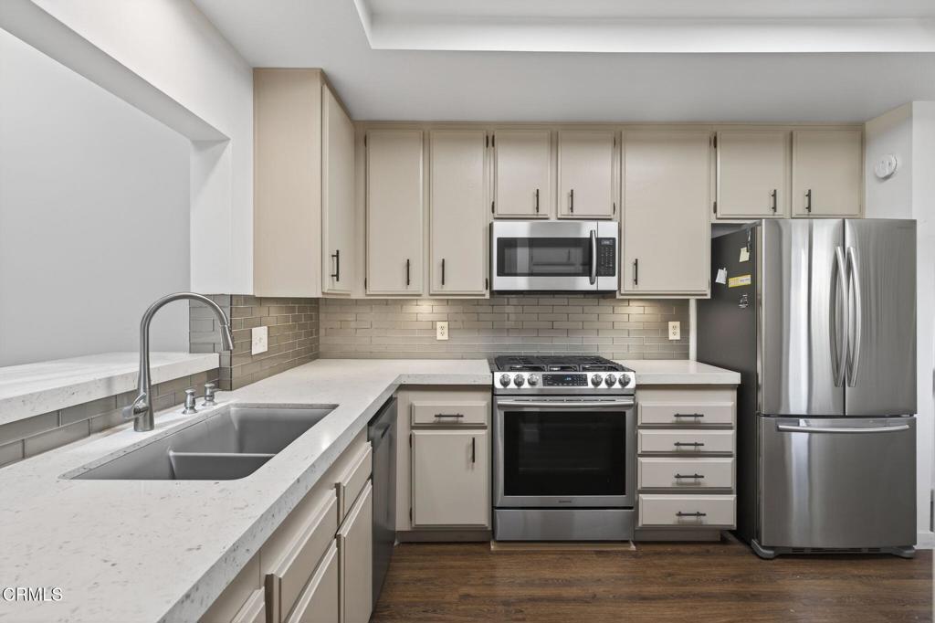 449 Reed Way Port Hueneme, CA 93041 - Photo 12 of 42 a kitchen with a sink stove and refrigerator