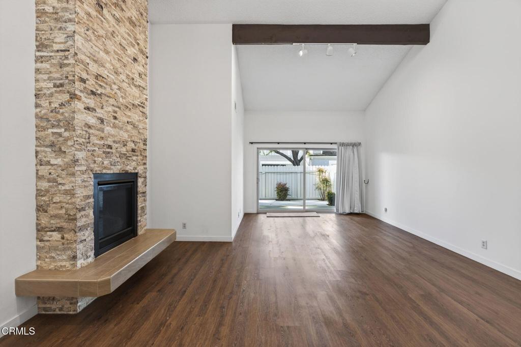 449 Reed Way Port Hueneme, CA 93041 - Photo 19 of 42 a view of empty room with wooden floor and fireplace