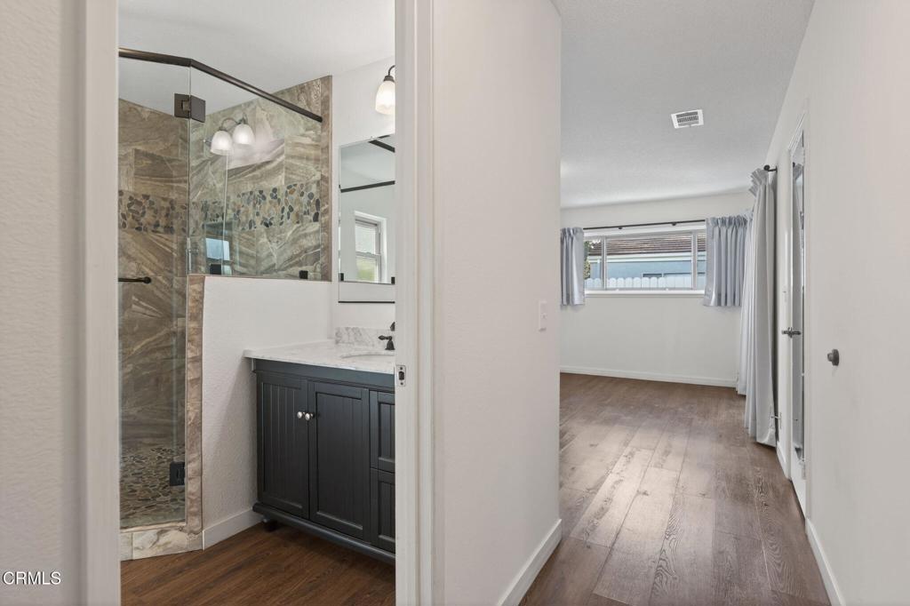 449 Reed Way Port Hueneme, CA 93041 - Photo 23 of 42 a view of empty room with wooden floor and fan