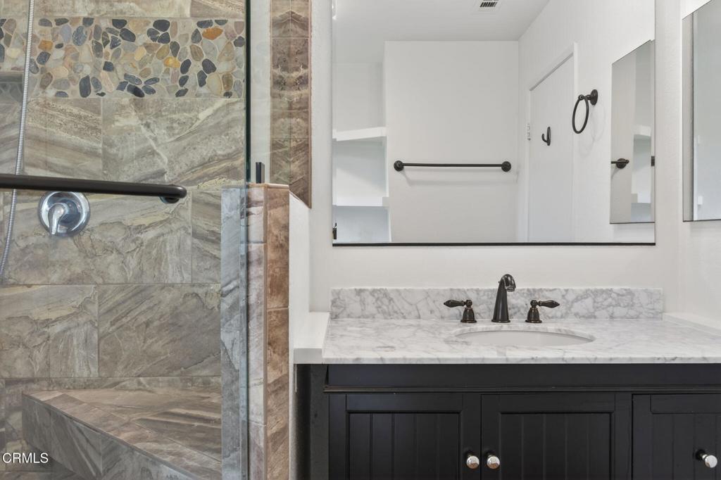 449 Reed Way Port Hueneme, CA 93041 - Photo 24 of 42 a bathroom with a sink and a mirror