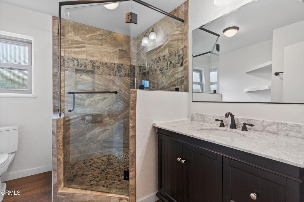 449 Reed Way Port Hueneme, CA 93041 - Photo 26 of 42 a bathroom with a sink and a mirror