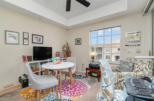 a view of a livingroom with furniture and a flat screen tv