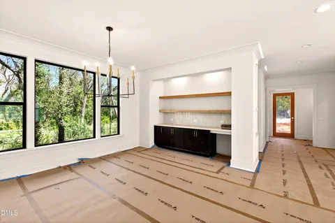a view of an empty room and fire place