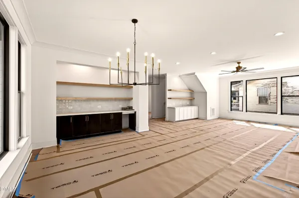 a kitchen with stainless steel appliances granite countertop a sink a stove and a refrigerator