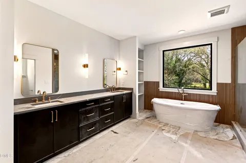 a room with a wooden floor and white walls