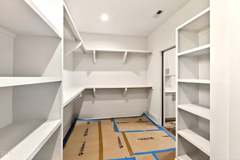 a view of a hallway with closet area