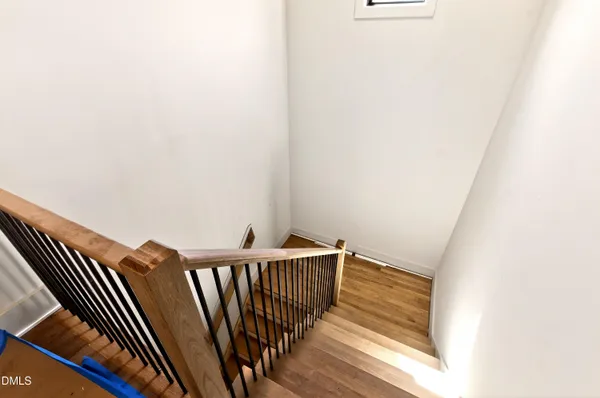 a view of an empty room with a ceiling fan