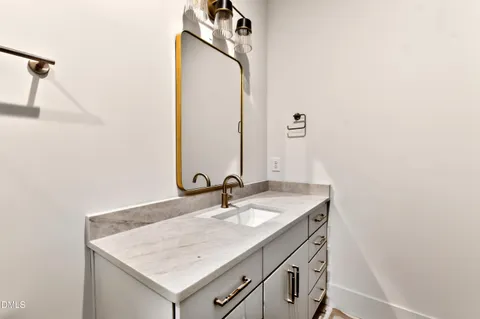 a kitchen with a sink and a stove top oven