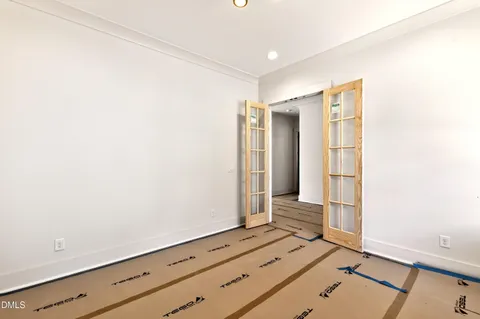 a view of room with wooden floor