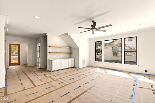 a view of an empty room and fire place