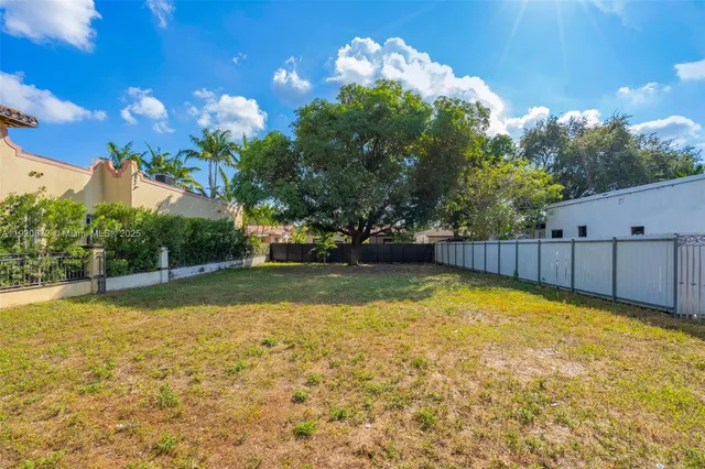 a view of a swimming pool with a yard