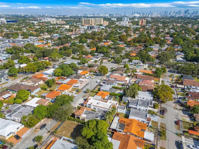 an aerial view of residential houses with outdoor space