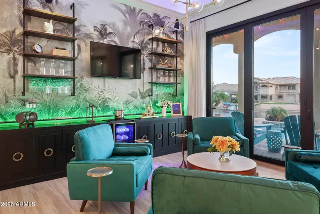 a living room with furniture and a large window