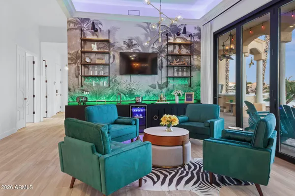 a living room with furniture a rug and a flat screen tv