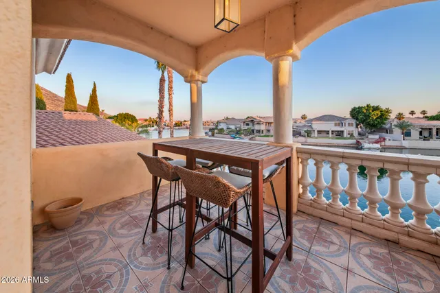 a spacious bedroom with a bed and wooden floor