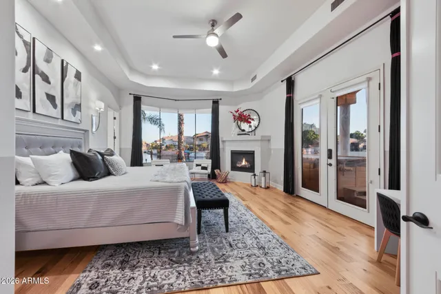 a kitchen with white cabinets and refrigerator