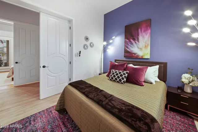 a view of a lake with table and chairs