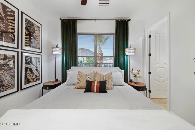 a view of a patio with a table and chairs under an umbrella