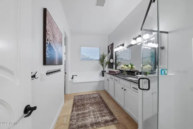 a view of a patio with table and chairs potted plants with wooden floor