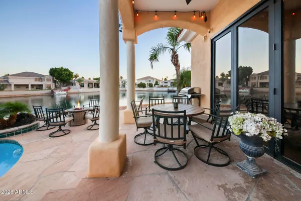 a view of a chairs and table in th terrace