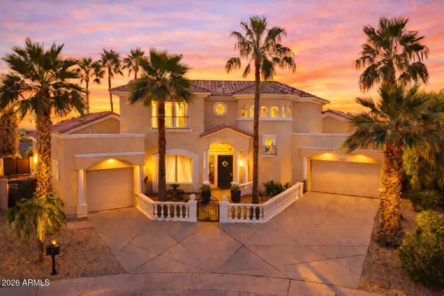 a front view of a building with a yard