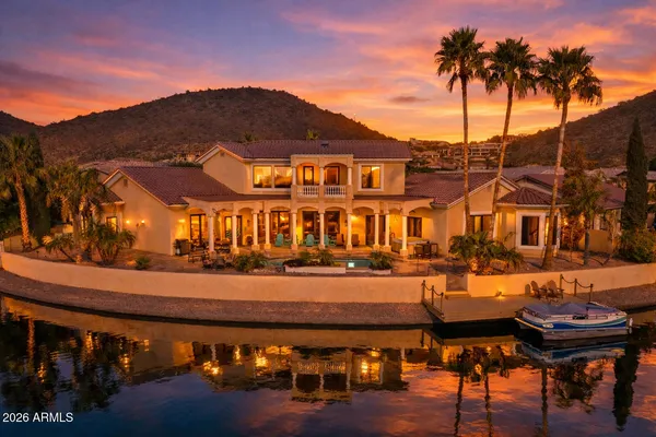 a kitchen with stainless steel appliances granite countertop a stove and a wooden floors