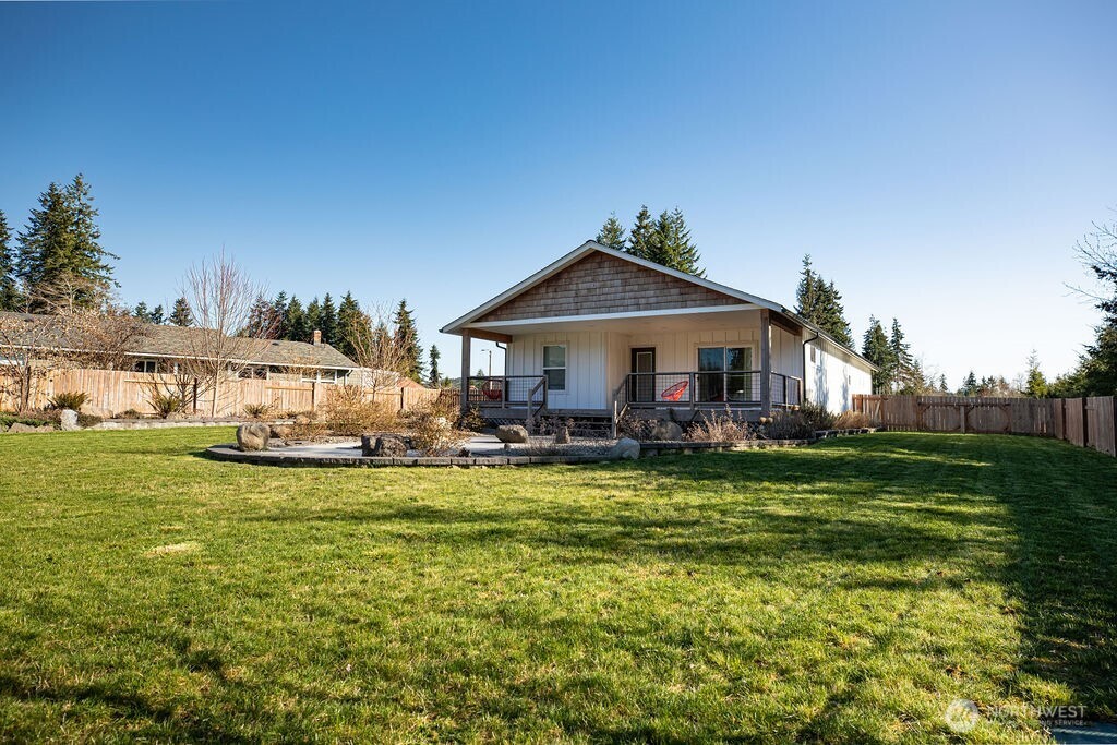 997 King Johns Way Forks, WA 98331 - Photo 23 of 39 a front view of a house with swimming pool having outdoor seating