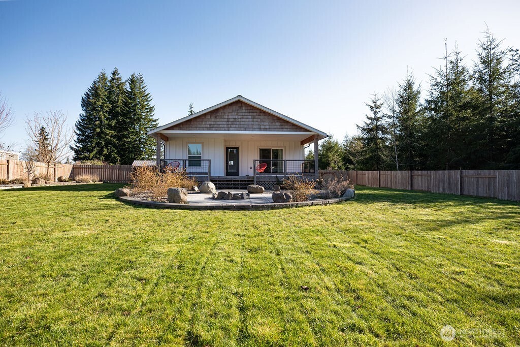 997 King Johns Way Forks, WA 98331 - Photo 24 of 39 a view of a house with pool and a yard