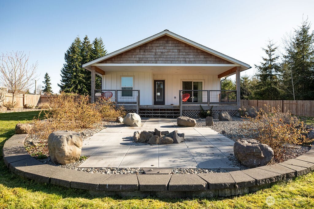 997 King Johns Way Forks, WA 98331 - Photo 26 of 39 a view of a house with backyard water fountain and sitting area