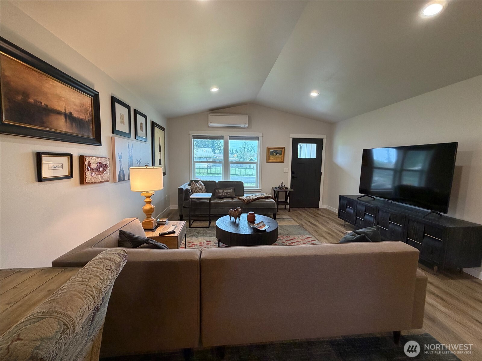 997 King Johns Way Forks, WA 98331 - Photo 3 of 39 a living room with furniture and a flat screen tv