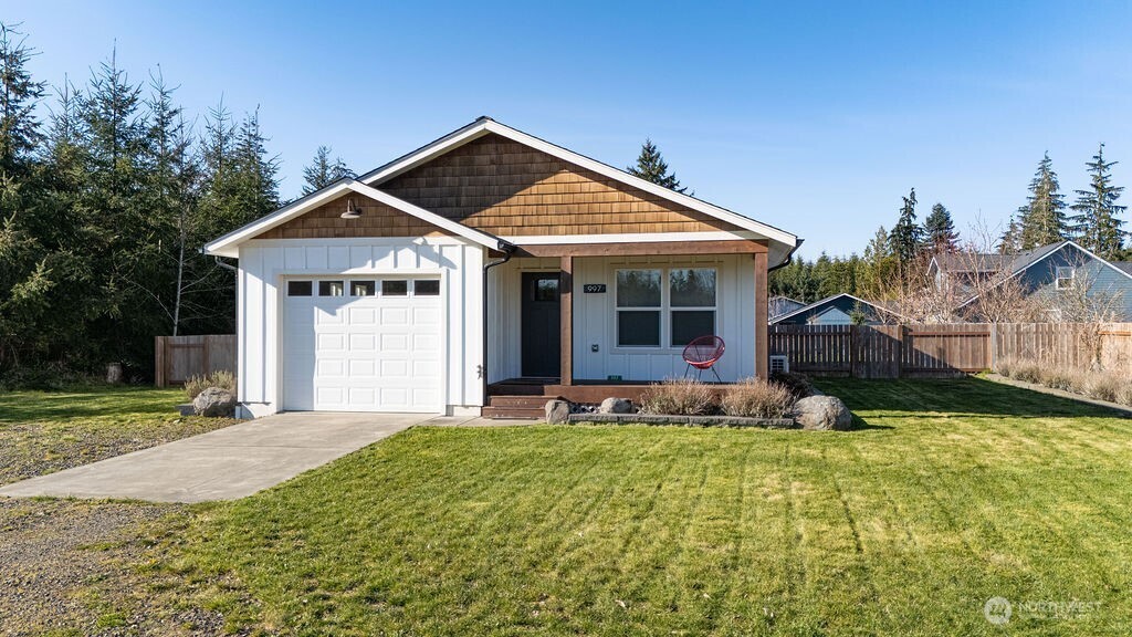 997 King Johns Way Forks, WA 98331 - Photo 31 of 39 a front view of a house with a yard