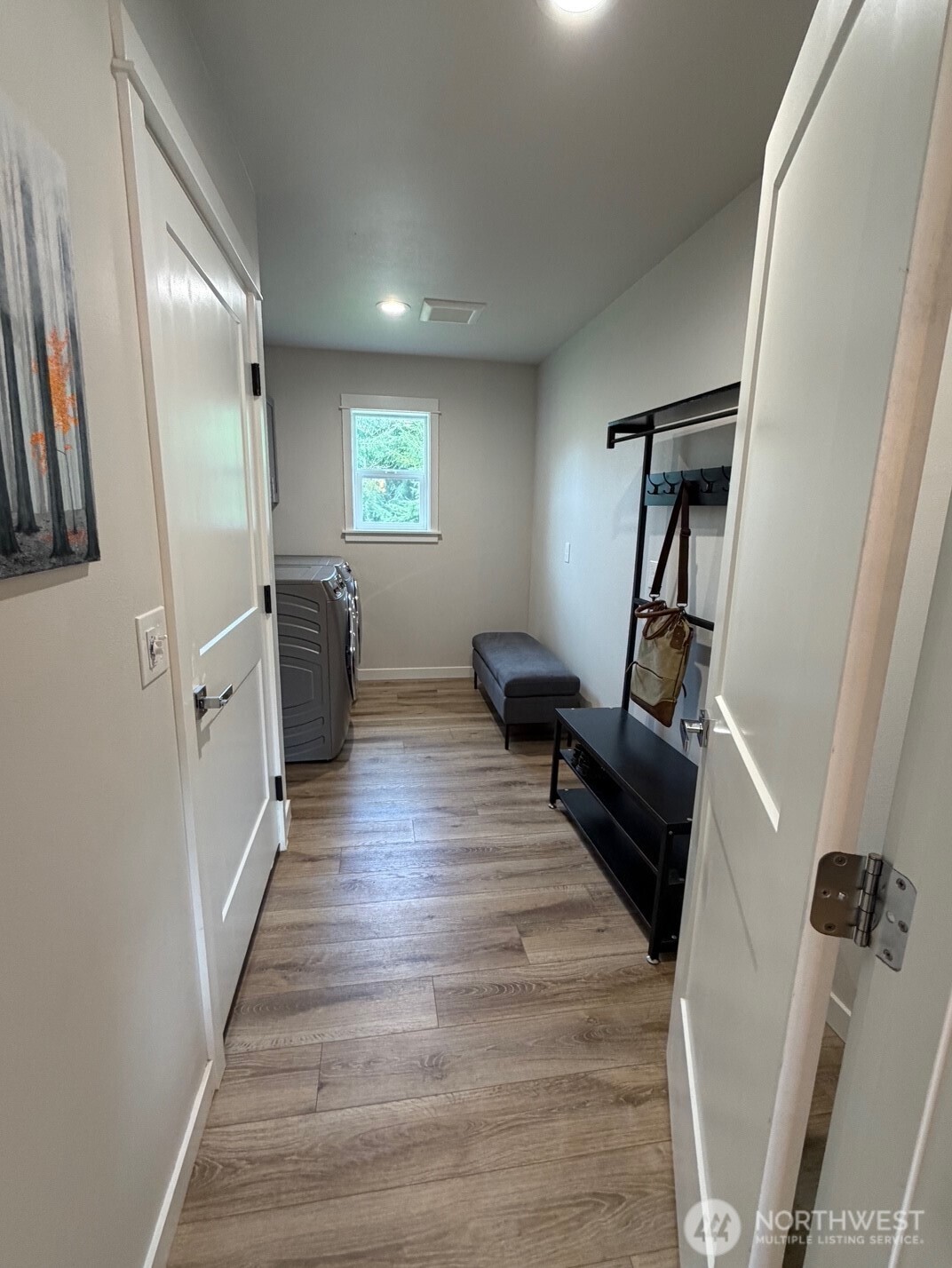 997 King Johns Way Forks, WA 98331 - Photo 9 of 39 a view of a hallway with wooden floor and furniture