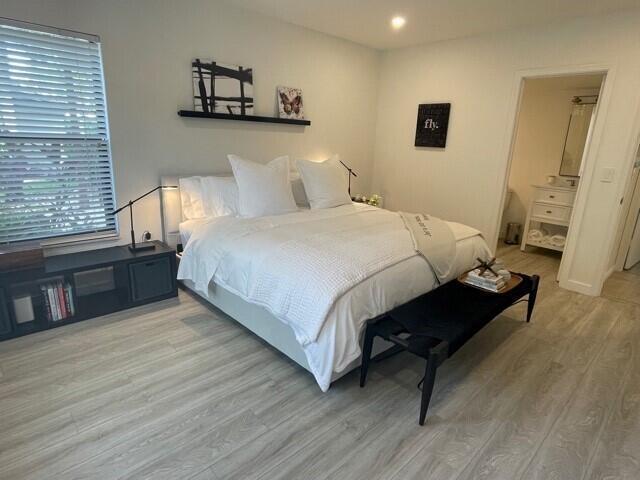 13400 Polo Road West Wellington, FL 33414 - Photo 9 of 16 a bedroom with a bed and a night stand