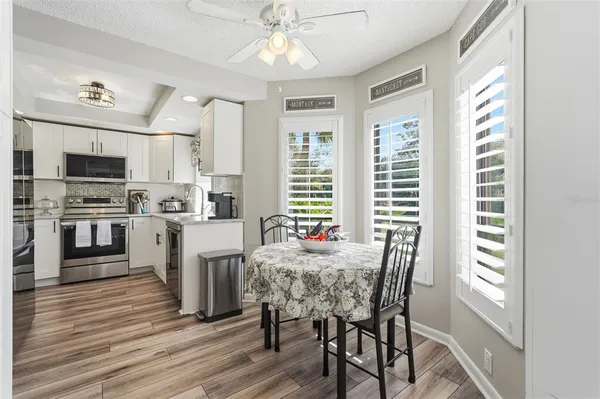 a view of a dining room with furniture window and wooden floor
