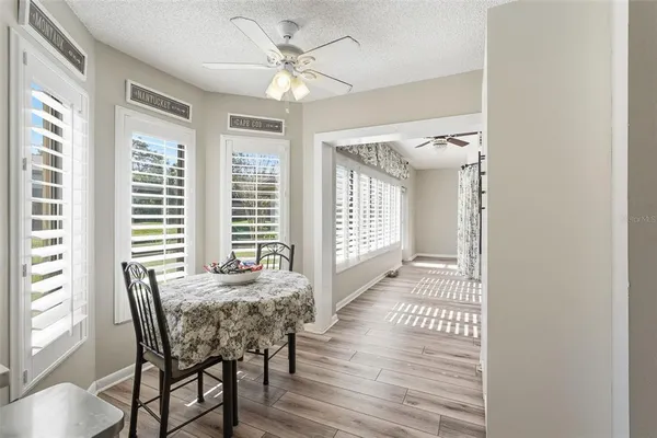 a view of a dining room with furniture window and wooden floor