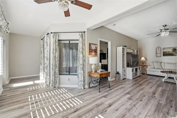 a living room with furniture and a window