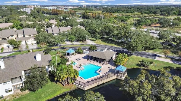 an aerial view of a house with a yard