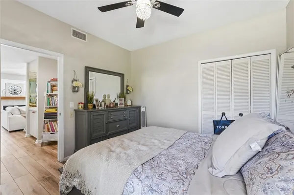 a bedroom with a bed and a dresser
