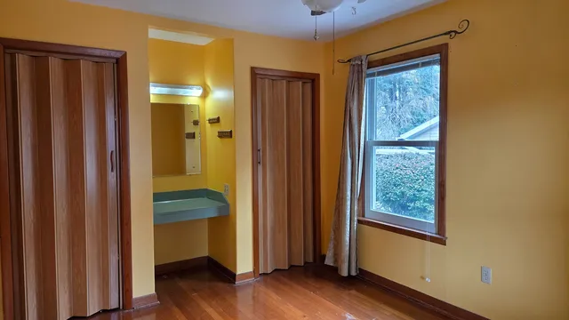 a view of front door with wooden floor