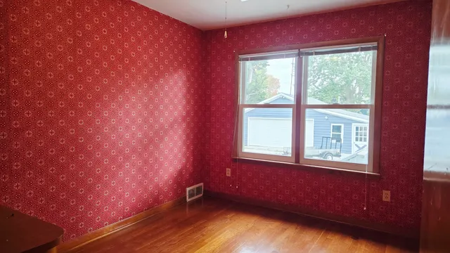 a view of an empty room with stairs